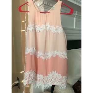 sleeveless blouse with lace embellishments